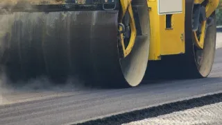 Steamroller rolling asphalt